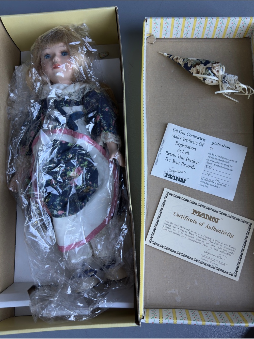 Porcelain Collectible Doll in Navy Floral Dress.